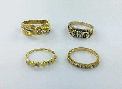Two 750-th gold half-wedding bands, partially...