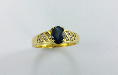 750-thousandths gold ring set with one stone...