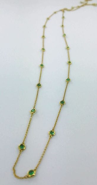 750-thousandths gold long necklace set alternately...