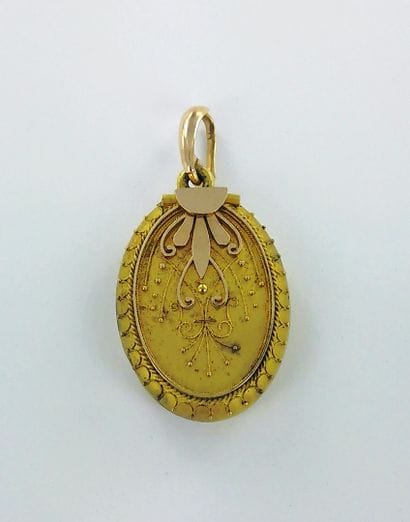 750-thousandths gold medallion pendant; 375-thousandths...