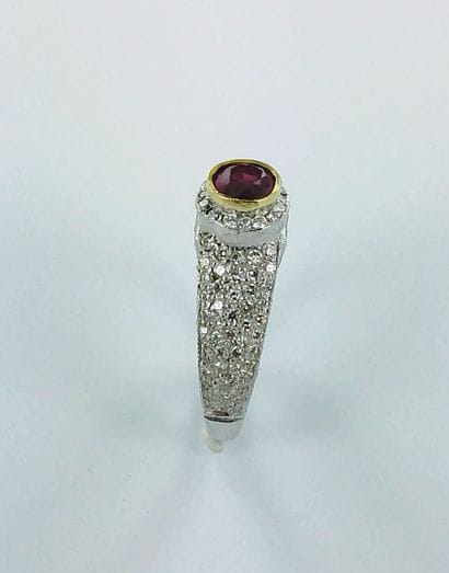 A two-tone 750-thousandths gold ring set...