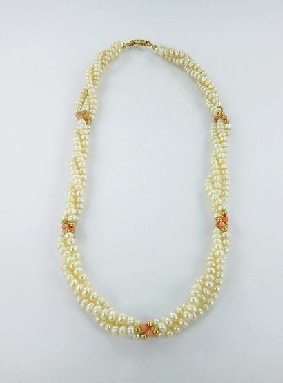 Three-strand twisted pearl necklace, featuring...
