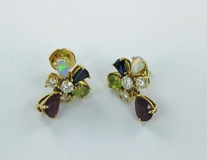 Pair of 750-thousandths gold earrings set...