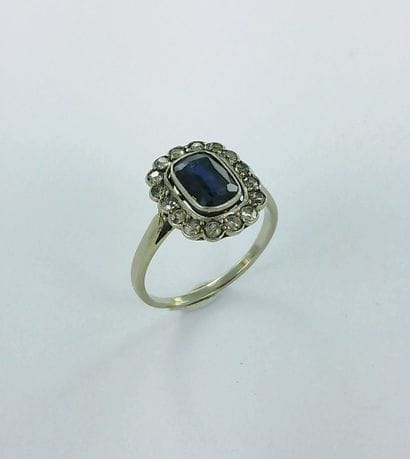 750-thousandths white gold ring set with...