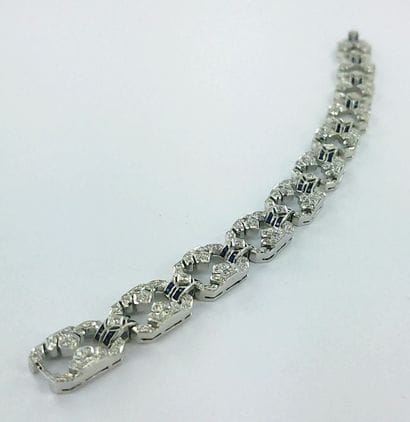 Bracelet articulé or gris 750 millièmes serti...