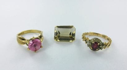 585-thousandths gold ring set with a red...