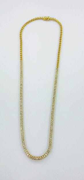 Collier rivière or 750 millièmes serti de...