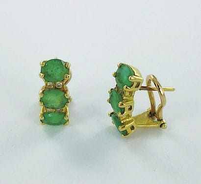 Pair of 750-thousandths gold earrings set...