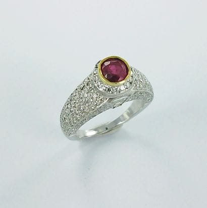 A two-tone 750-thousandths gold ring set...