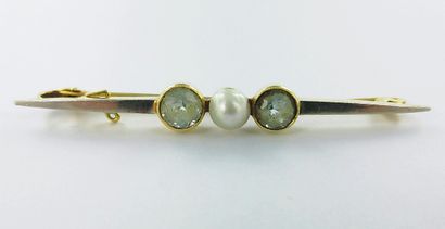 A two-tone gold brooch set with two aquamarines...