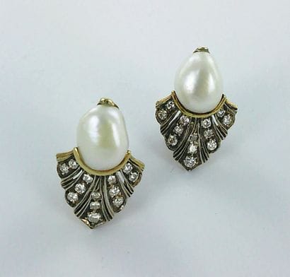 Pair of 750-thousandths gold earrings set...