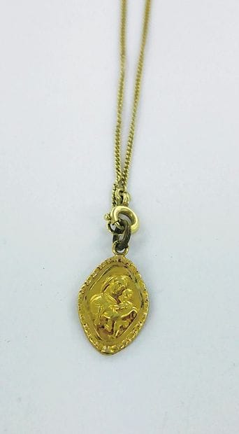 585-thousandths gold necklace with a medallion...