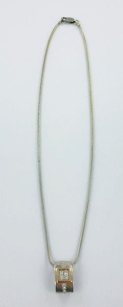 750-thousandths two-tone gold pendant set...