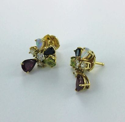 Pair of 750-thousandths gold earrings set...