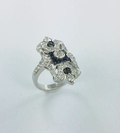 750-thousandths white gold ring set with...