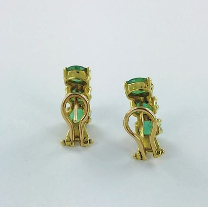 Pair of 750-thousandths gold earrings set...