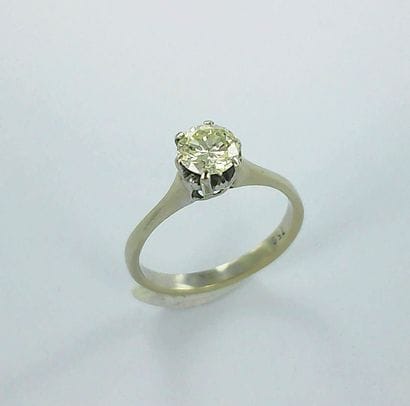 750-thousandths white gold ring set with...