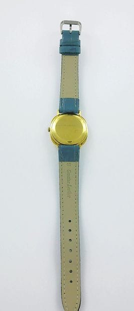BULOVA.
750-thousandths gold watch on a leather...