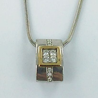 750-thousandths two-tone gold pendant set...