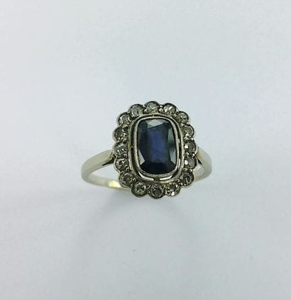 750-thousandths white gold ring set with...