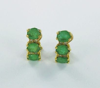 Pair of 750-thousandths gold earrings set...