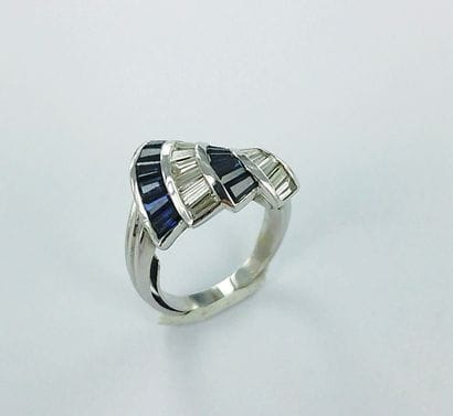 750-thousandths white gold ring set with...