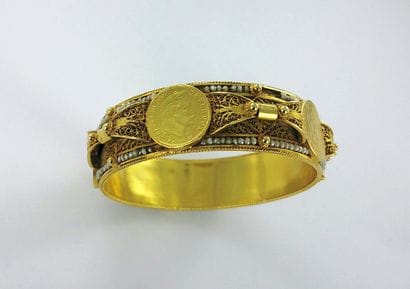 Wide 750-thousandths gold bracelet set with...