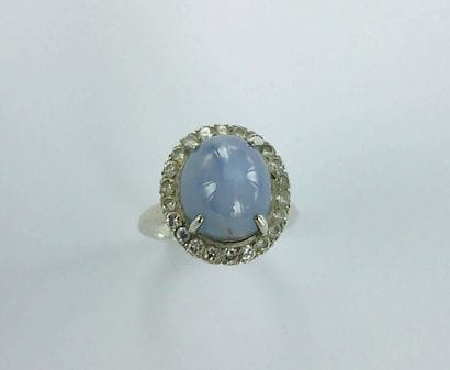 Silver ring set with a star-shaped cabochon...