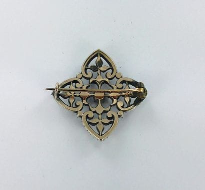 750-thousandths two-tone gold brooch set...