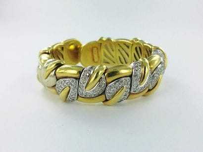 Flexible 750-th gold bracelet with a floral...