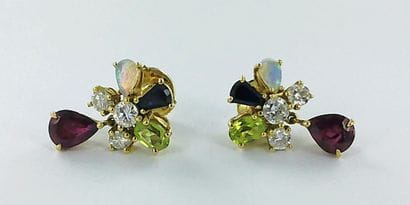 Pair of 750-thousandths gold earrings set...