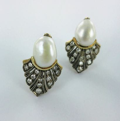 Pair of 750-thousandths gold earrings set...