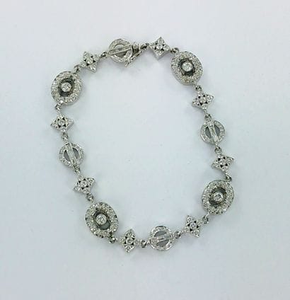 Bracelet or gris 750 millièmes à motifs articulés...
