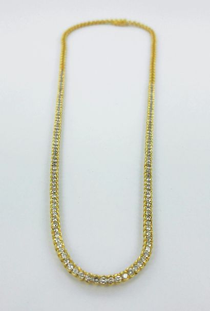 Collier rivière or 750 millièmes serti de...