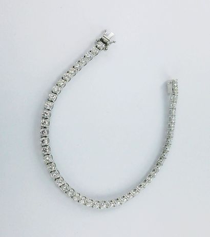 Bracelet ligne or gris 750 millièmes serti...