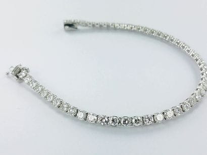 Bracelet ligne or gris 750 millièmes serti...