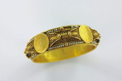 Wide 750-thousandths gold bracelet set with...