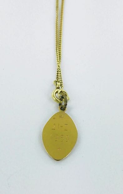 585-thousandths gold necklace with a medallion...