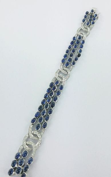 Bracelet or gris 750 millièmes à motifs articulés...
