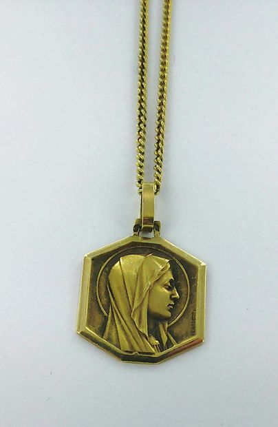 750-thousandths gold chain and pendant depicting...