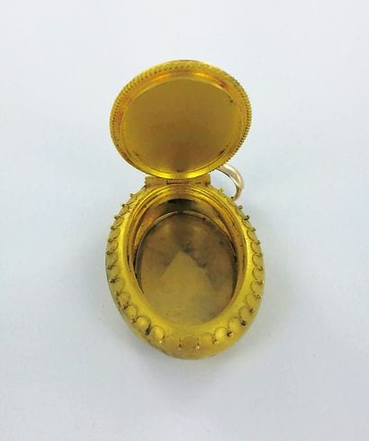 750-thousandths gold medallion pendant; 375-thousandths...