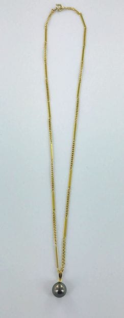 750-thousandths gold chain and pendant featuring...