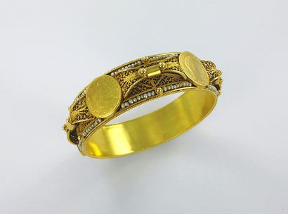 Wide 750-thousandths gold bracelet set with...