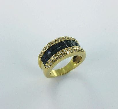 750-th gold ring set with calibrated sapphires...