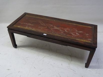 Table basse en bois exotique, le panneau...