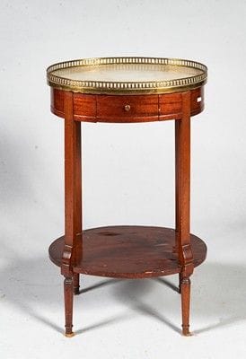 Table de salon de forme ovale en acajou et...