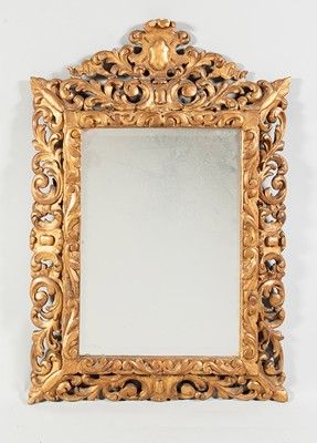 Miroir dans un encadrement en bois et stuc...