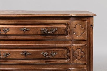 Walnut chest of drawers, the front curved...