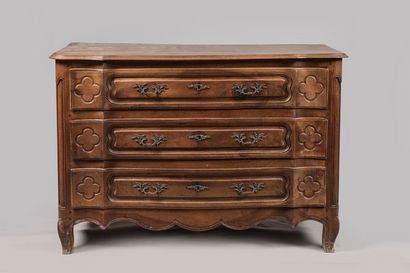 Walnut chest of drawers, the front curved...