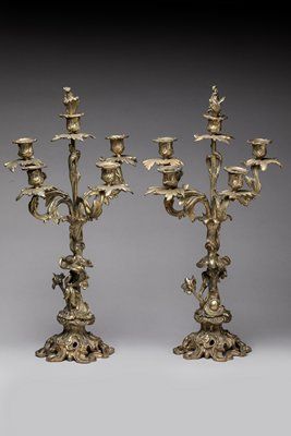 Pair of candelabras in chased and gilded...